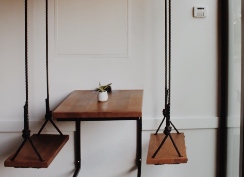 Tables that instead of chairs have swings