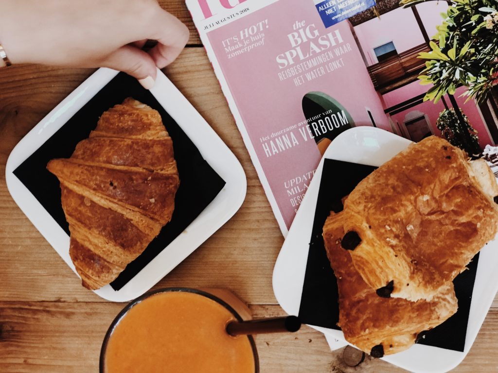 Croissant with orange shake top view