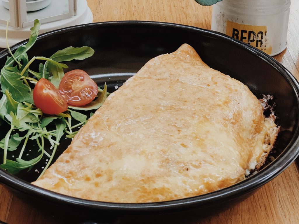 French breakfast omelette with small tomato