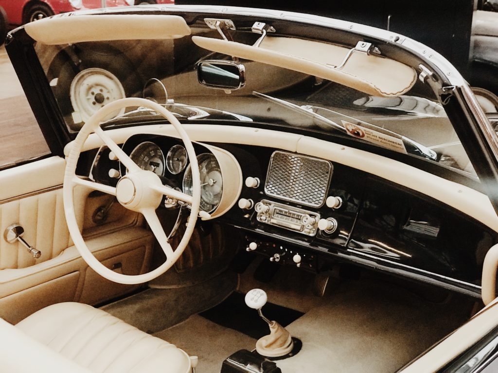 Interior, inside view, retro design car. Exhibition of vintage cars.