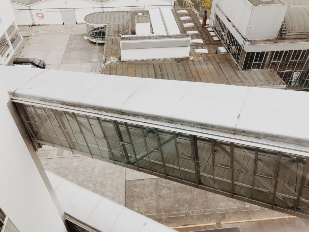 Specially-covered ramps that connect different floors between adjacent buildings