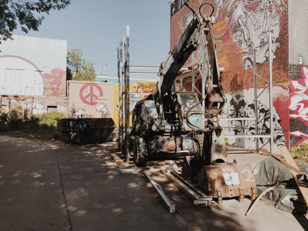 Mural and abandoned machinery in Berlin, Germany