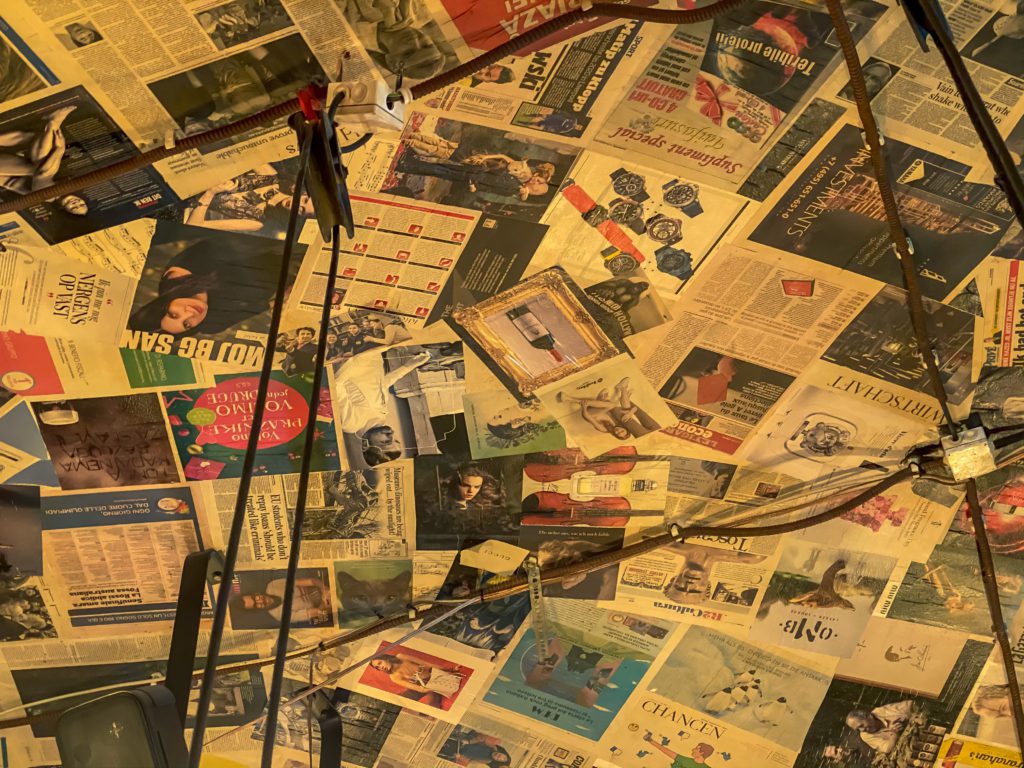 Ceiling with pages from newspapers glued to it